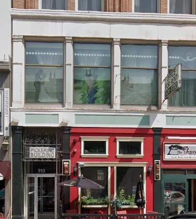 The Pickering Building, 913, with a red storefront to the right, and an "OFFICE FOR RENT" sign.